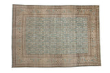 Vintage Tabriz carpet with a distressed Herati pattern in dusty ocean blue, sand, and muted brown.