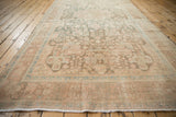 Lengthwise perspective of a distressed Hamadan runner showing its even, low pile wear.