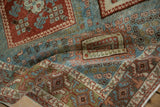 Evenly worn low pile on a vintage Afshar rug with blue and red rust geometric guls.