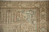 Detailed corner of a distressed Mehriban rug with even wear and a dusty teal boteh motif.