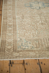 Double boteh plant motif with serrated contours on a vintage distressed Persian rug border.