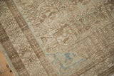 Even, low-pile texture of a distressed Mehriban rug in beige, sand, and pale seafoam.