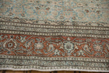 Worn, low pile showing the rust turtle samovar border on a vintage distressed Tabriz carpet.