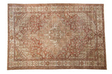 Vintage distressed Baktiari carpet with a stepped geometric medallion, shown in dusty chestnut, ivory, and pale coffee brown.