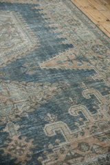 Angled detail of a distressed Persian Veece carpet showing wear to the knot heads.