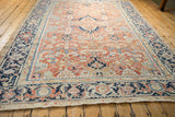 Vintage Gorevan carpet with intricate navy Turtle Samovar border and pale brick red field palmettes.
