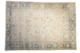 Distressed vintage Heriz carpet with an ivory allover field and a Turtle Samovar border in dusty blue and brown.