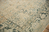Geometric Turtle Samovar border with low-pile texture on a distressed vintage Persian Heriz rug.