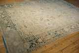 Worn corner of a distressed Heriz carpet with its dusty blue and brown Turtle Samovar border.