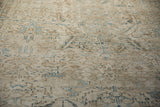 Angled view of the distressed Heriz carpet's mostly even wear to knot heads.