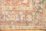 Geometric Turtle Samovar border motif on a distressed Heriz carpet with a low, even pile.