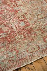 Detail showing the distressed pile and Turtle Samovar border on a vintage Heriz carpet.