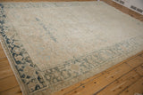 Distressed Heriz carpet border showcasing Turtle Samovar design in dusty teal and beige.