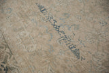 Distressed vintage Heriz carpet texture, revealing knot head wear and dusty blue design motifs.