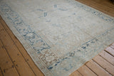 Corner detail of distressed Mehrivan rug with dusty blue Turtle Samovar border motif and intact selvage.