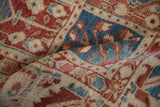 Hand-knotted texture and even wear of a Baktiari carpet's panelled floral motifs.