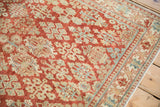 Pawn motif border in powder blue and sand on a vintage distressed Joshegan rug.