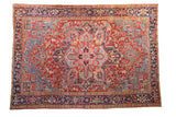 Vintage Heriz rug with a quatrefoil medallion and Turtle Samovar border in gem tones of red and blue.