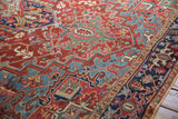 Angled detail of the vintage Heriz carpet's dense, geometric pile and Turtle Samovar border.