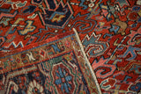 Vintage Heriz rug: folded border revealing Turtle Samovar motif, red field patterns, and foundation.