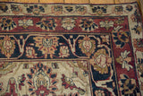 Antique Kerman carpet corner with palmette and arabesque border, floral spandrel.