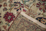 Antique Kerman rug's intricate hand-knotted foundation and cochineal floral pile.