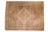 Distressed vintage Baktiari carpet, oversized medallion with faded burgundy, blue, and ivory florals.
