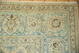 Tabriz carpet corner with distressed sapphire blue and ivory palmette design, mostly even wear.