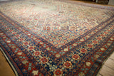 Vintage Joshegan carpet, detail of navy blue pawn border and field with Four Seasons design.