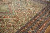 Varied diamond patterns and reciprocating pawn motifs in cherry red and navy on vintage Joshegan carpet.