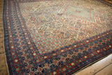 Corner detail of vintage Joshegan carpet showing reciprocating pawn border in cherry red and navy.
