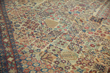 Close-up of the vintage Joshegan carpet's intricate lattice design and unique pawn border.