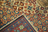 Close-up of vintage Joshegan carpet corner, showing detailed pile, side selvage, and woven foundation.