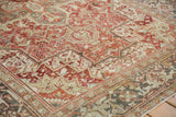 Distressed Heriz border with turtle samovar design, faded ruby red, beige, and blue colors.
