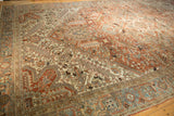 Distressed Mehrivan carpet detail: copper field, beige spandrel, slate blue Turtle Samovar border.