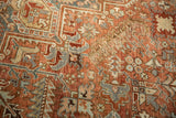 Distressed vintage Mehrivan carpet showing worn pile, time-softened copper and blue patterns.