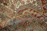 Vintage distressed Mehrivan carpet's textured pile, copper, slate blue, and beige serrated motifs.