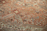 Patinaed texture of vintage Mehrivan carpet, featuring copper, sand, and slate blue Herati pattern.