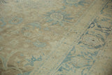 Vintage Distressed Tabriz rug, faded pale brown field with dusty blue floral arabesques.