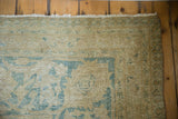 Distressed vintage Tabriz carpet corner, pale coffee brown, dusty blue worn pile, visible foundation.