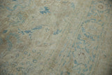 Distressed vintage Tabriz carpet pile with faded pale coffee brown and dusty blue floral arabesques.