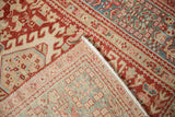 The hand-knotted foundation of a vintage Karaja rug, visible at the rug's folded corner.