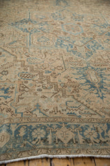 Distressed vintage Heriz rug border detail, with dusty blue Herati and turtle samovar motifs.