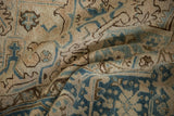 Distressed vintage Heriz rug pile showing even wear, muted beige, and dusty sky blue.