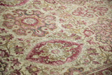 Textured wear to the knot heads of a distressed Kerman floral carpet.
