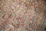 Intricate floral patterns in raspberry and seafoam green with distressed wear down to the knot heads.
