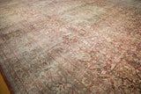 Heavy abrash and mostly even wear across the low pile of this distressed Persian carpet.