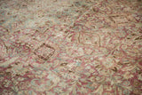 Mostly even wear on a vintage Persian carpet showing the knot heads and floral weave.
