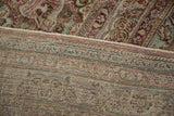 Detail of the hand-knotted foundation and distressed pile on a vintage Persian carpet.