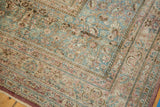 A detailed corner view showing the even wear and exposed foundation of a vintage distressed carpet.